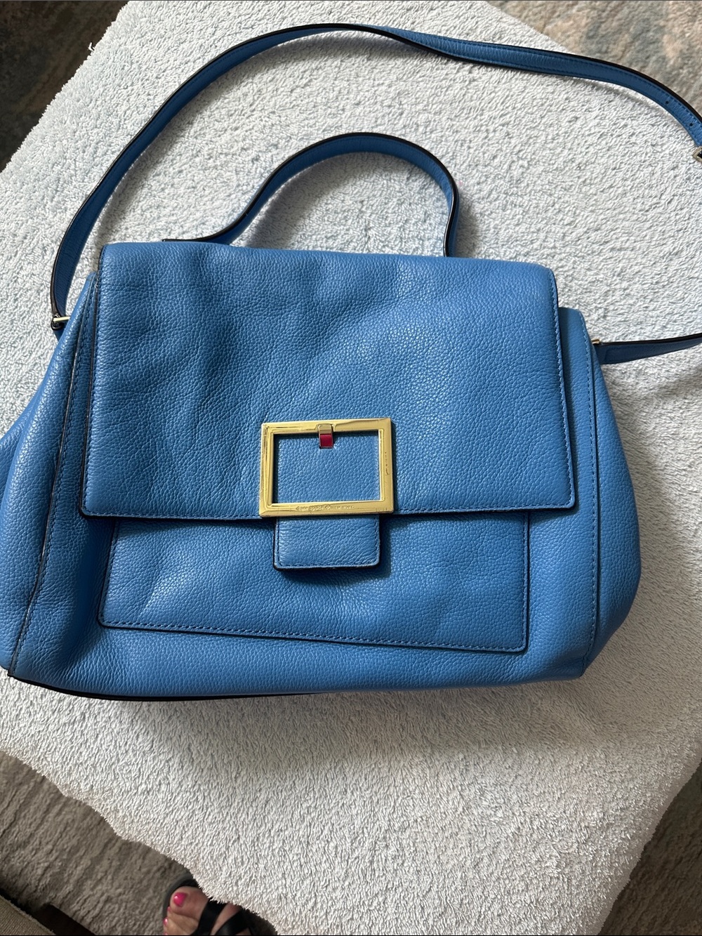 Blue Kate Spade purse.  Has several compartments.  Excellent condition.
